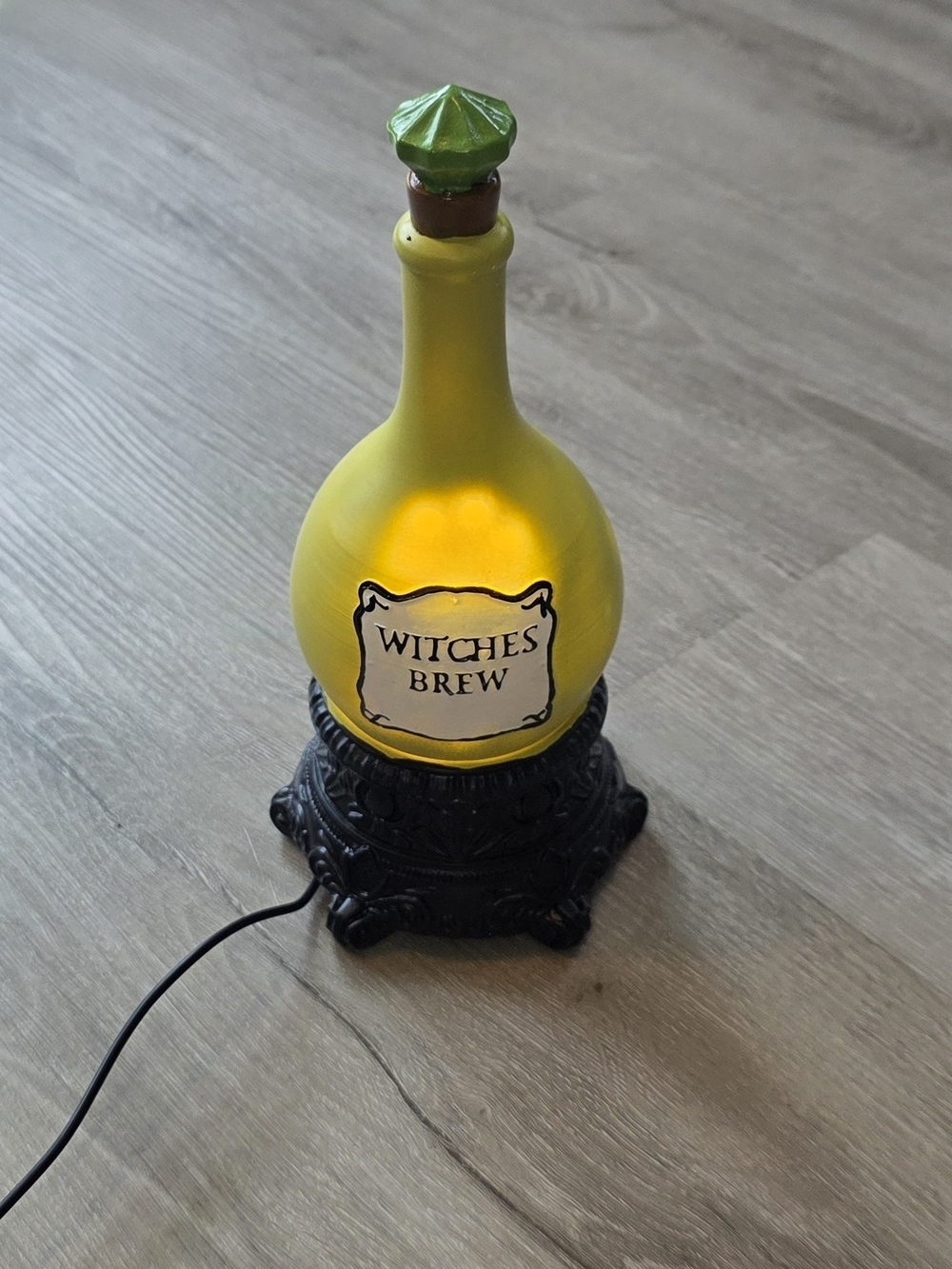 Witch’s Brew 10" Swirling LED Light-Up Potion Bottle Halloween Decor